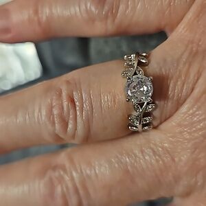 Size 6 silvery ring with leaf detailing = costume jewelry